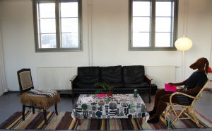 Urban Animal in boxers sitting in Elina Lahdenperä's Living Room.