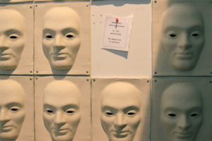 Image of ceramic face reliefs.